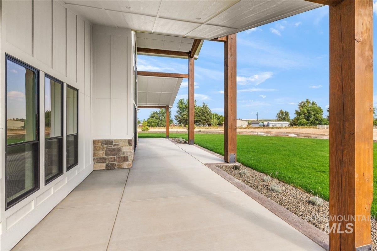 Covered porch with a yard