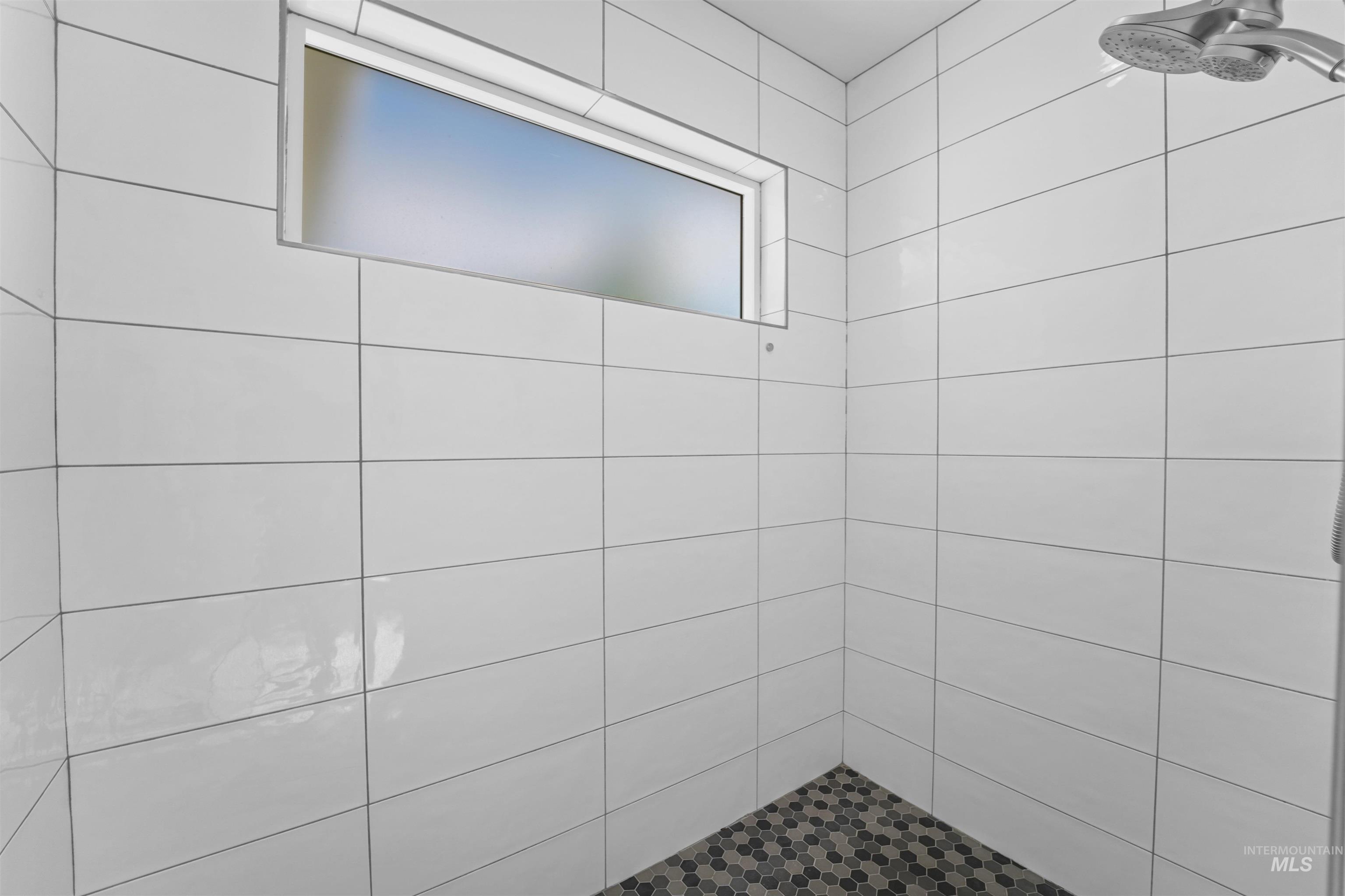Full bathroom featuring tiled shower