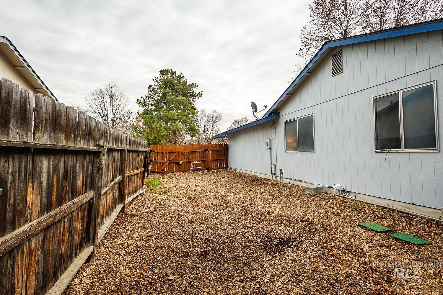 View of fenced backyard