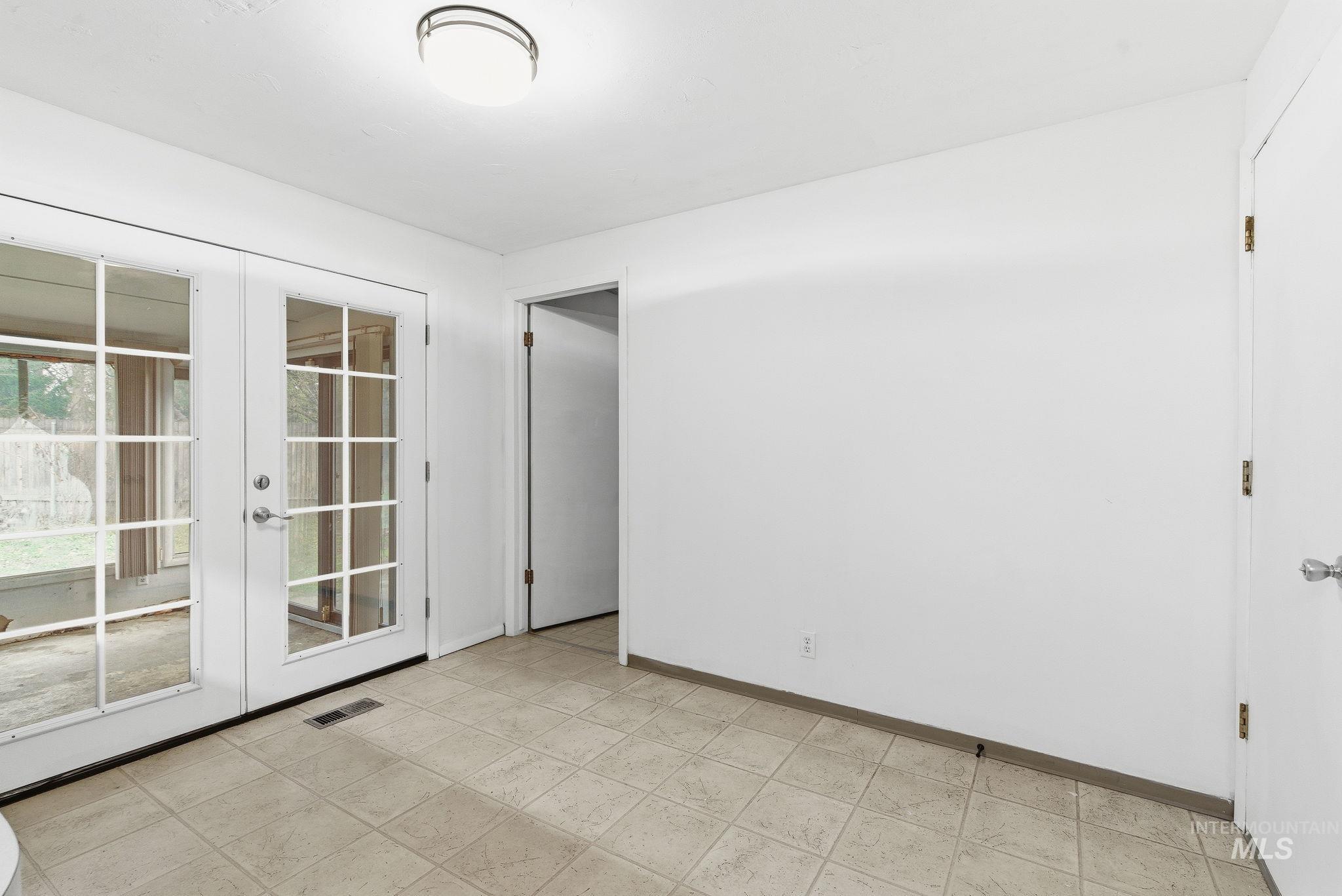 Eating area featuring french doors and baseboards