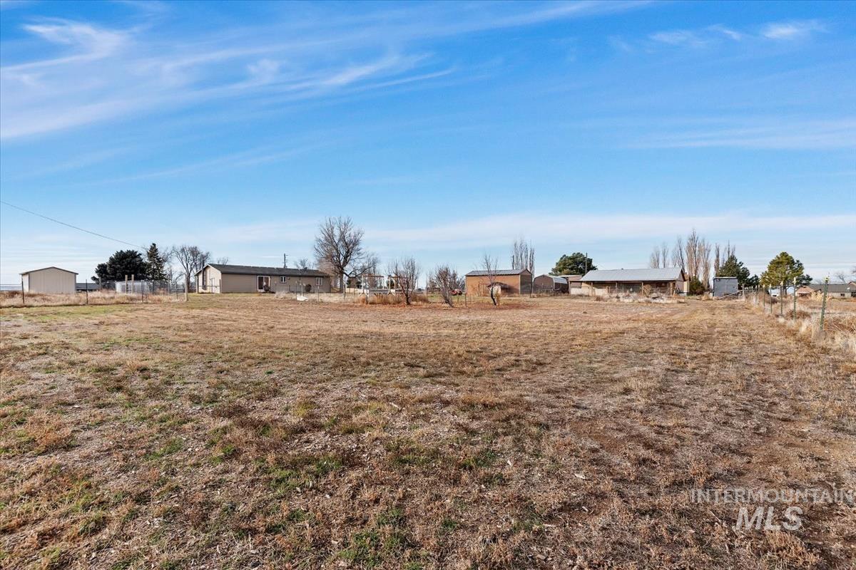 View of yard with a rural view