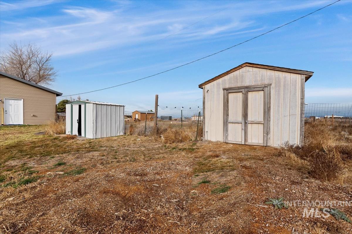 View of yard featuring a storage unit