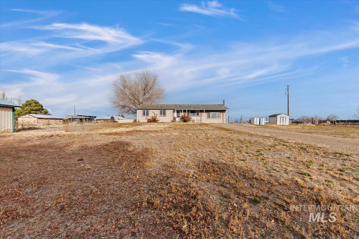 View of front of home with an outdoor structure