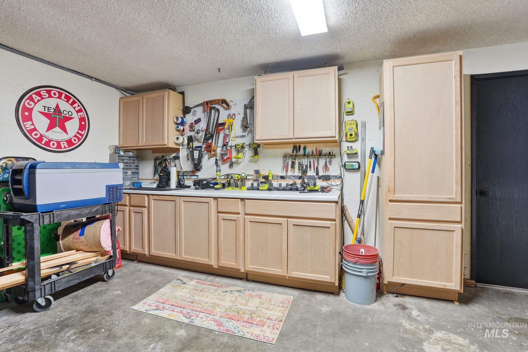 Garage featuring a workshop area