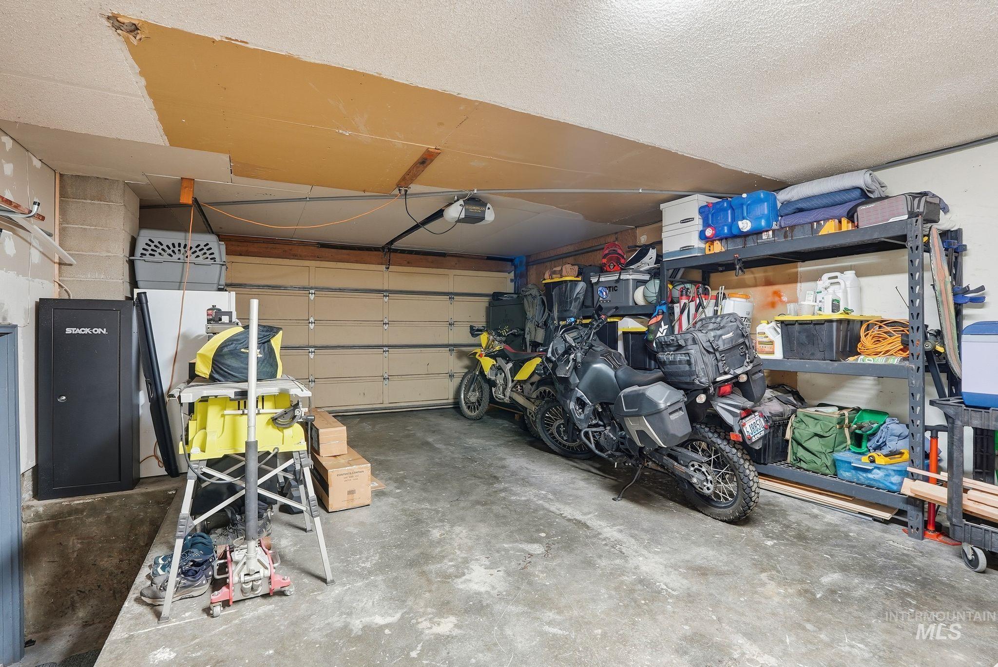 Garage featuring a garage door opener