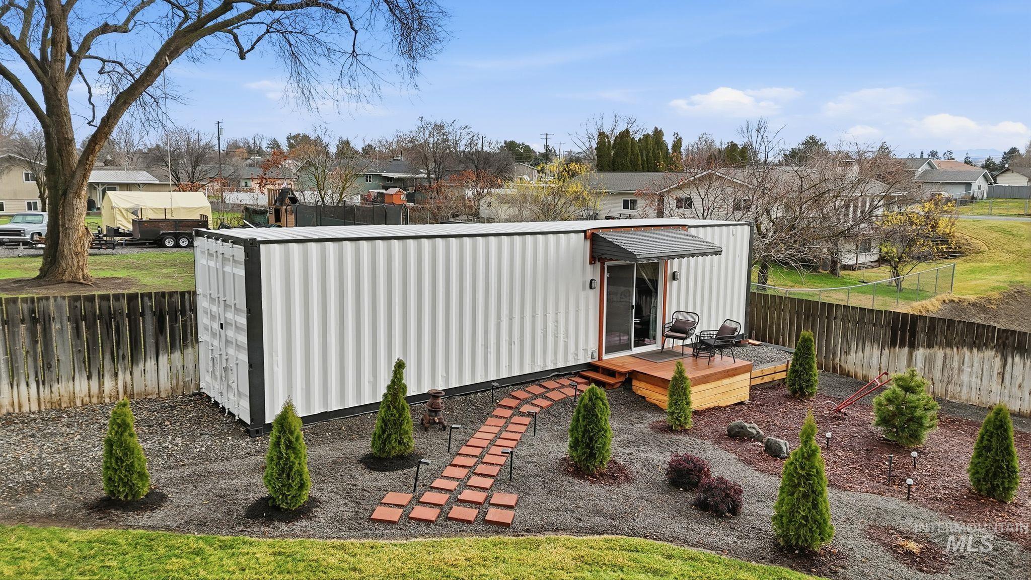 View of outbuilding with a fenced backyard and a residential view
