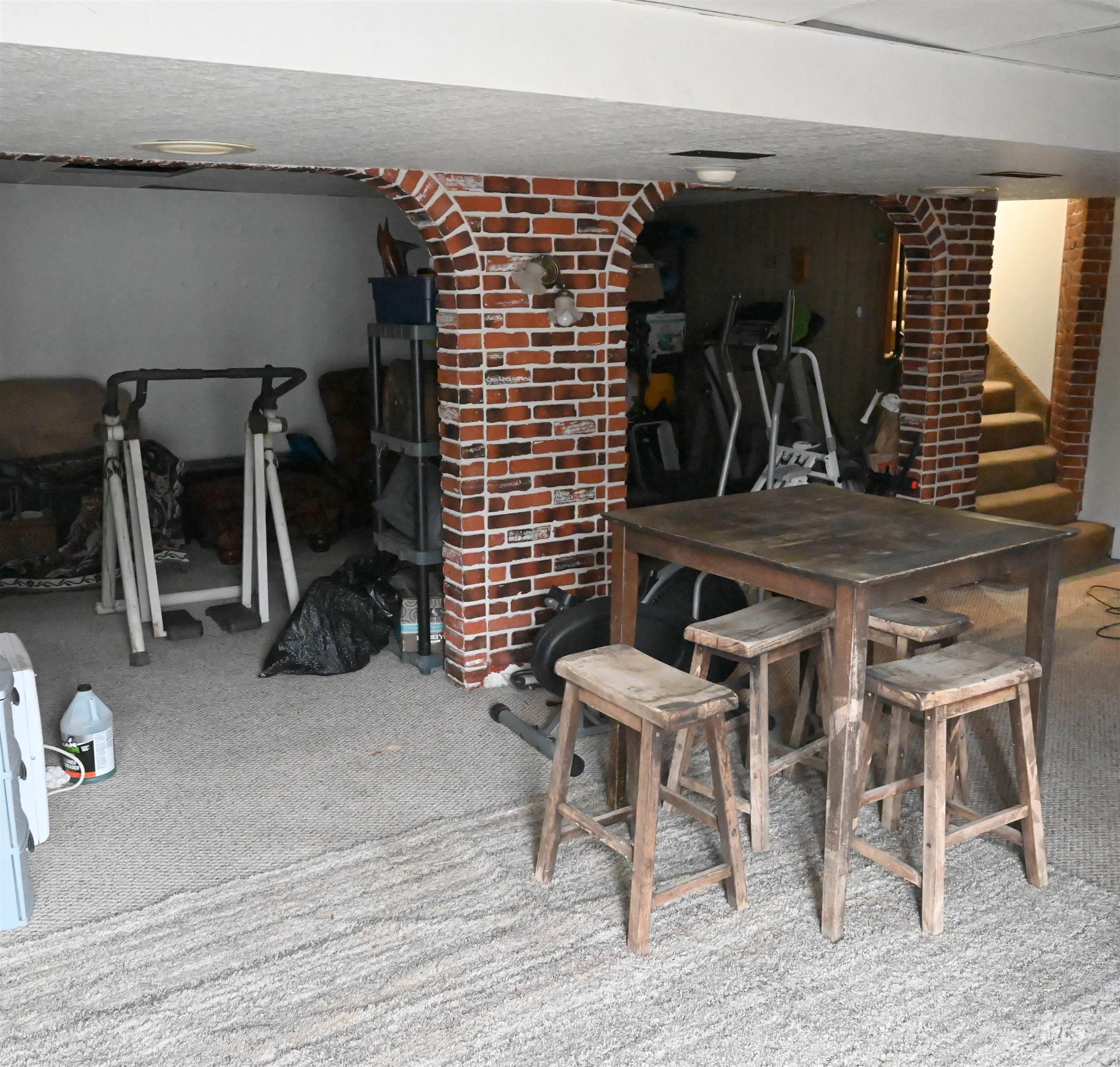 Dining space with carpet and stairway