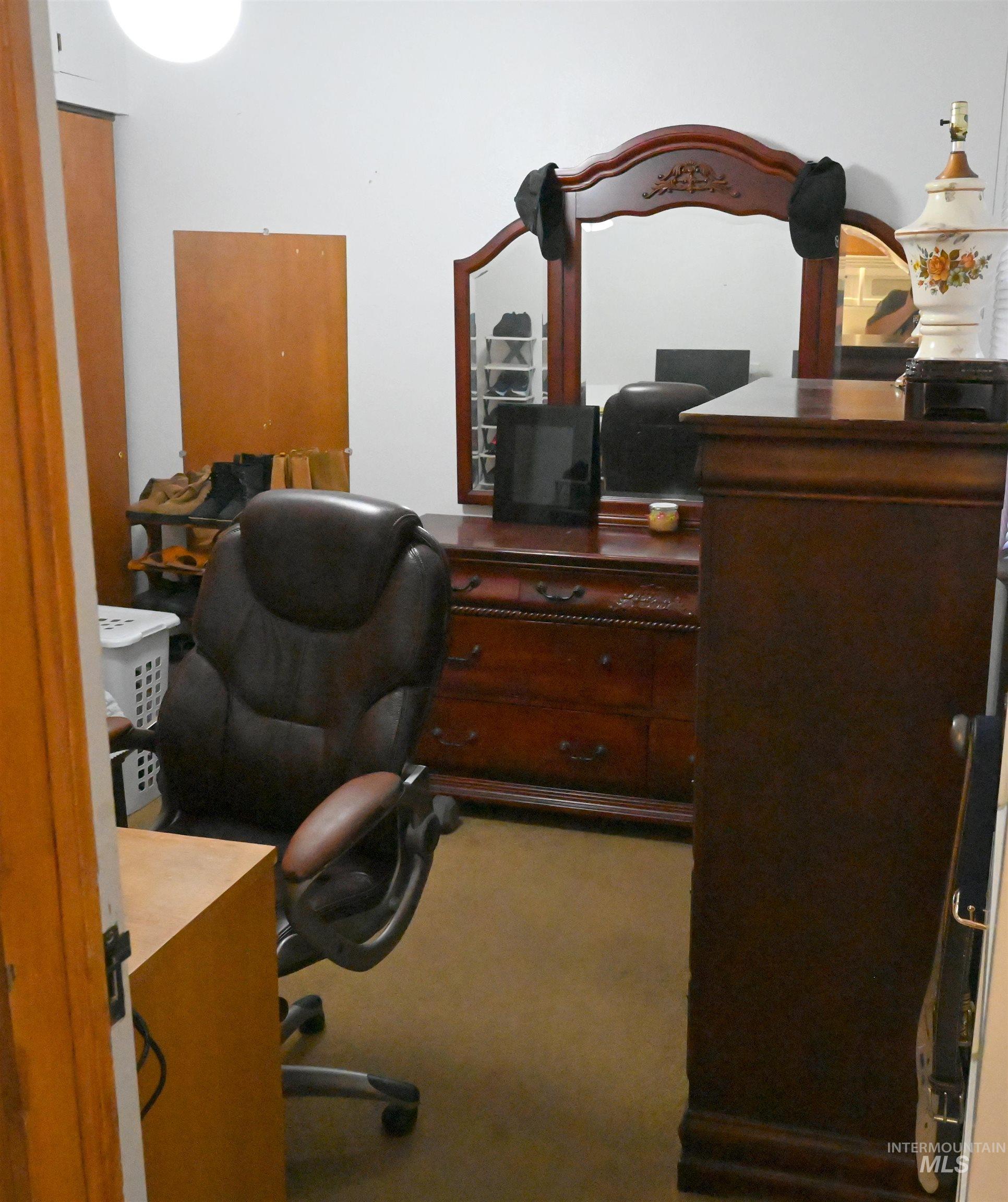 Office area featuring light carpet