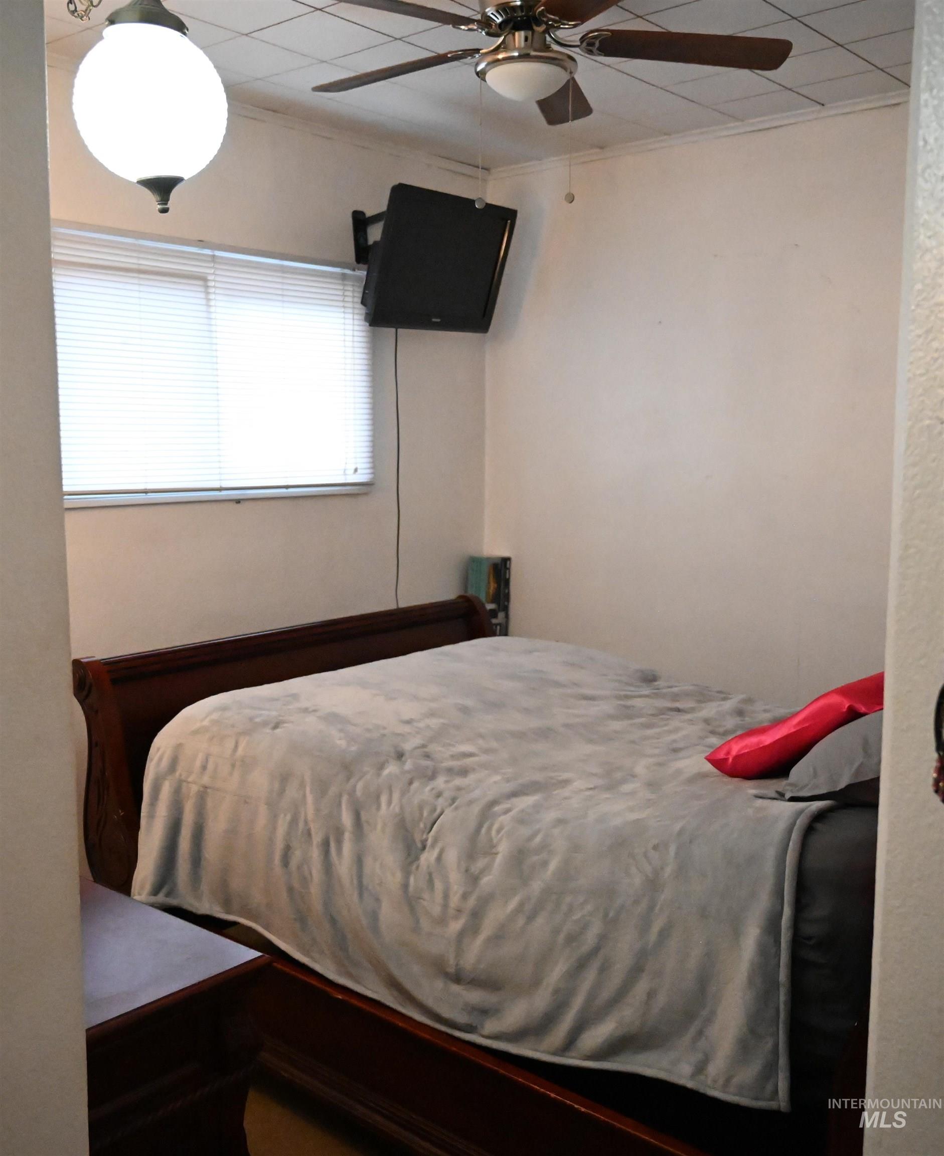 Bedroom featuring a ceiling fan