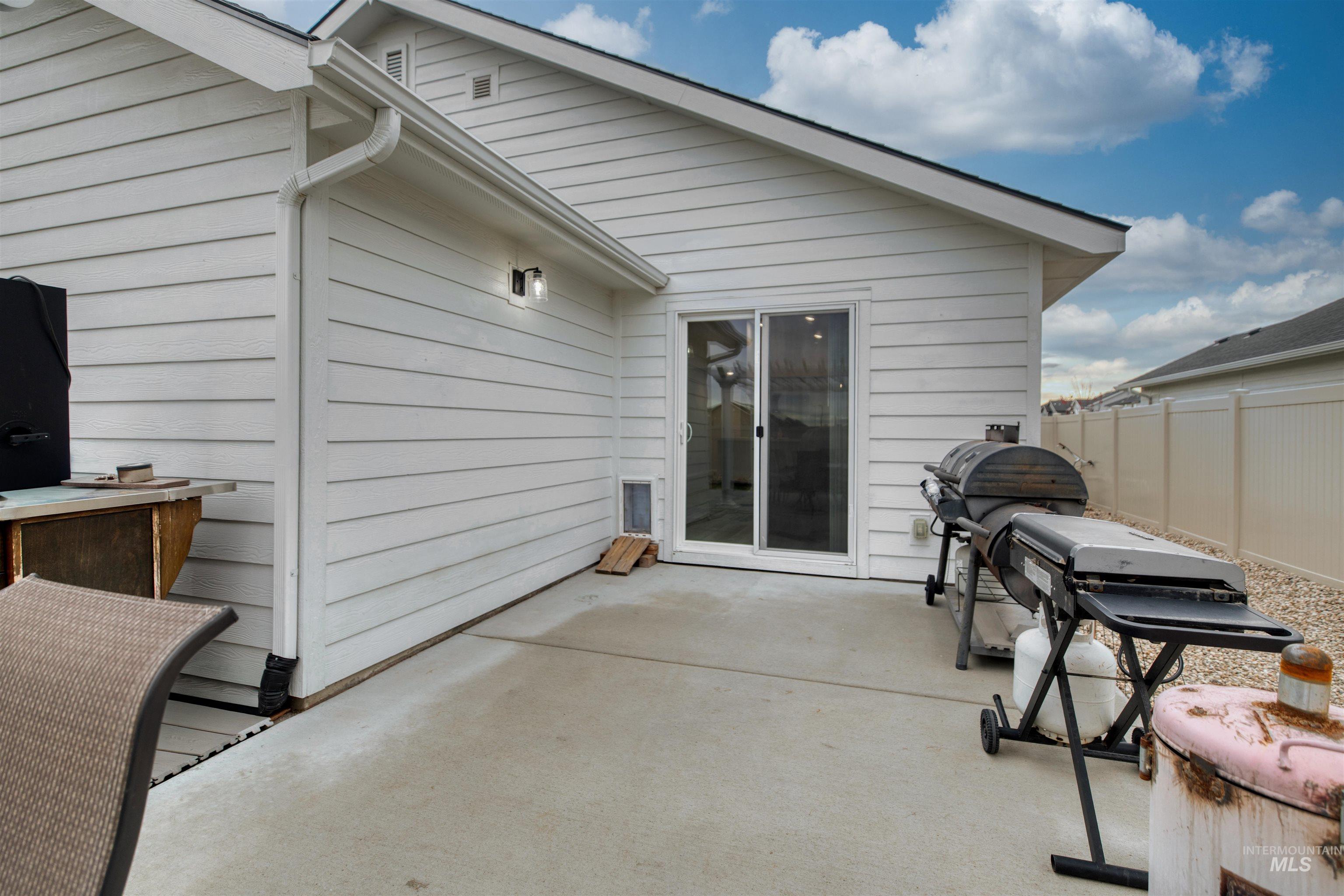 Back of property with a patio