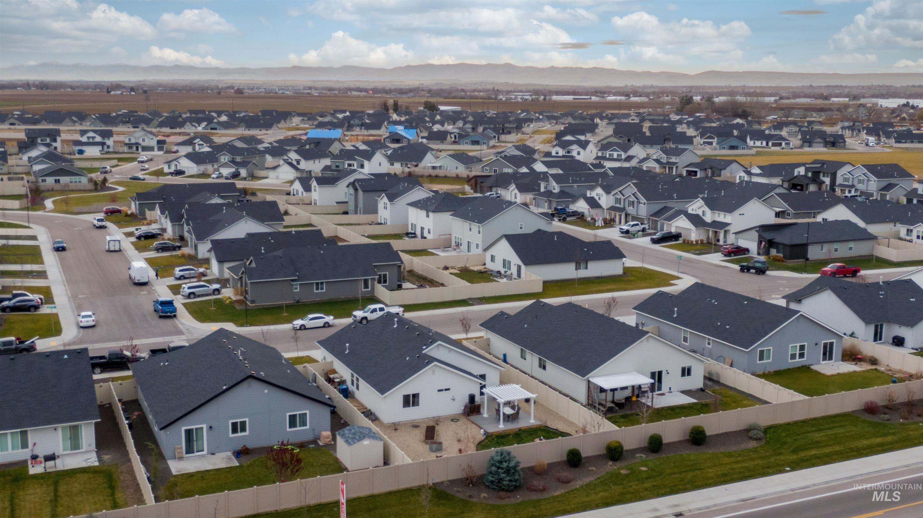 Aerial perspective of suburban area with mountains