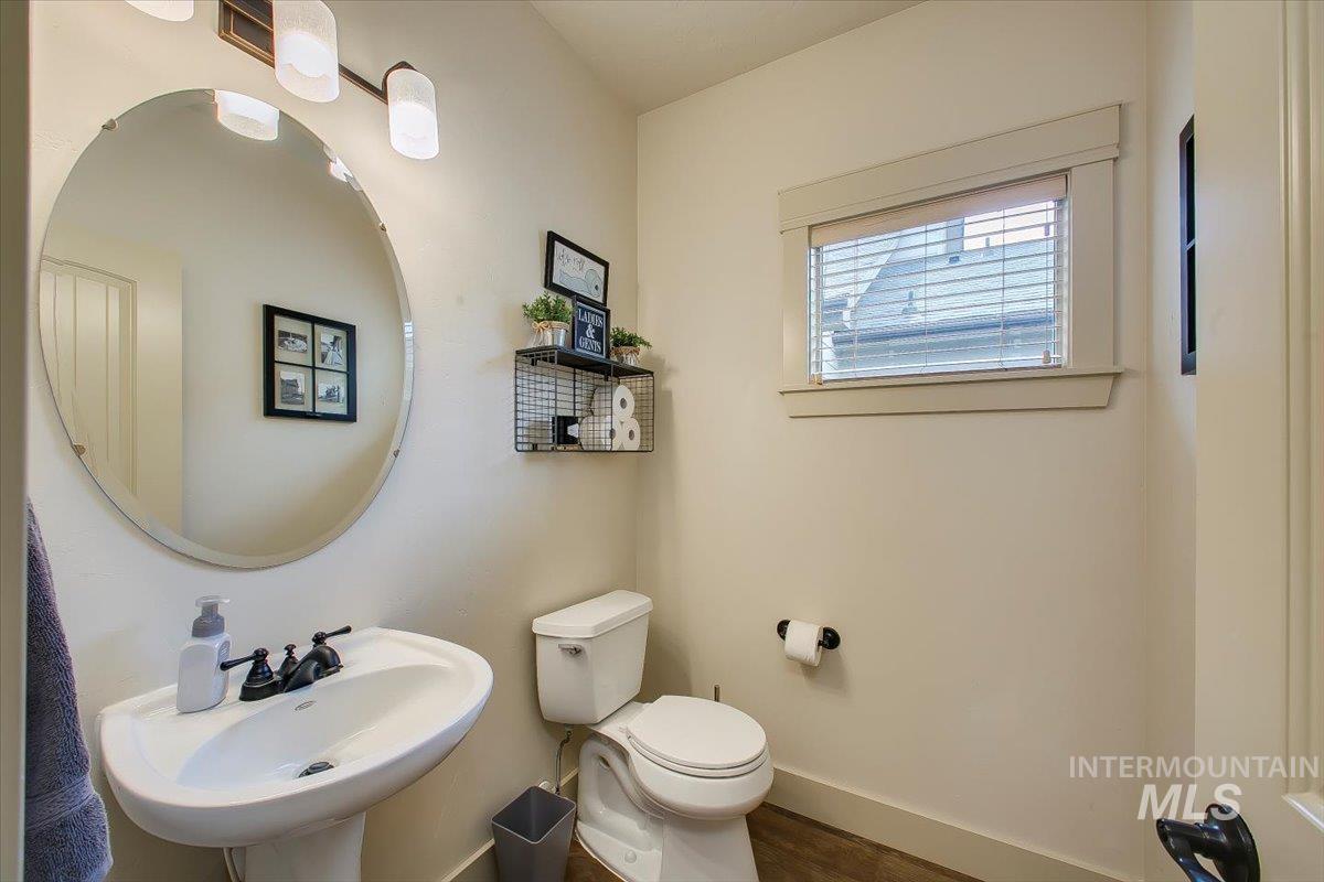 Bathroom with baseboards and wood finished floors
