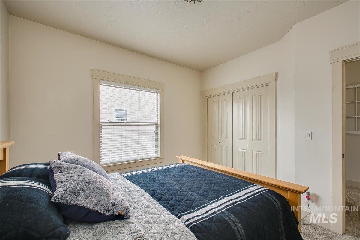 Bedroom with carpet flooring and a closet