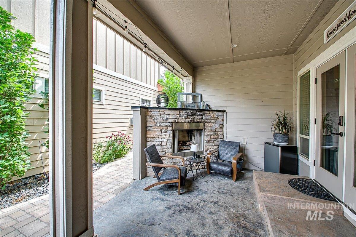 View of patio / terrace with an outdoor stone fireplace
