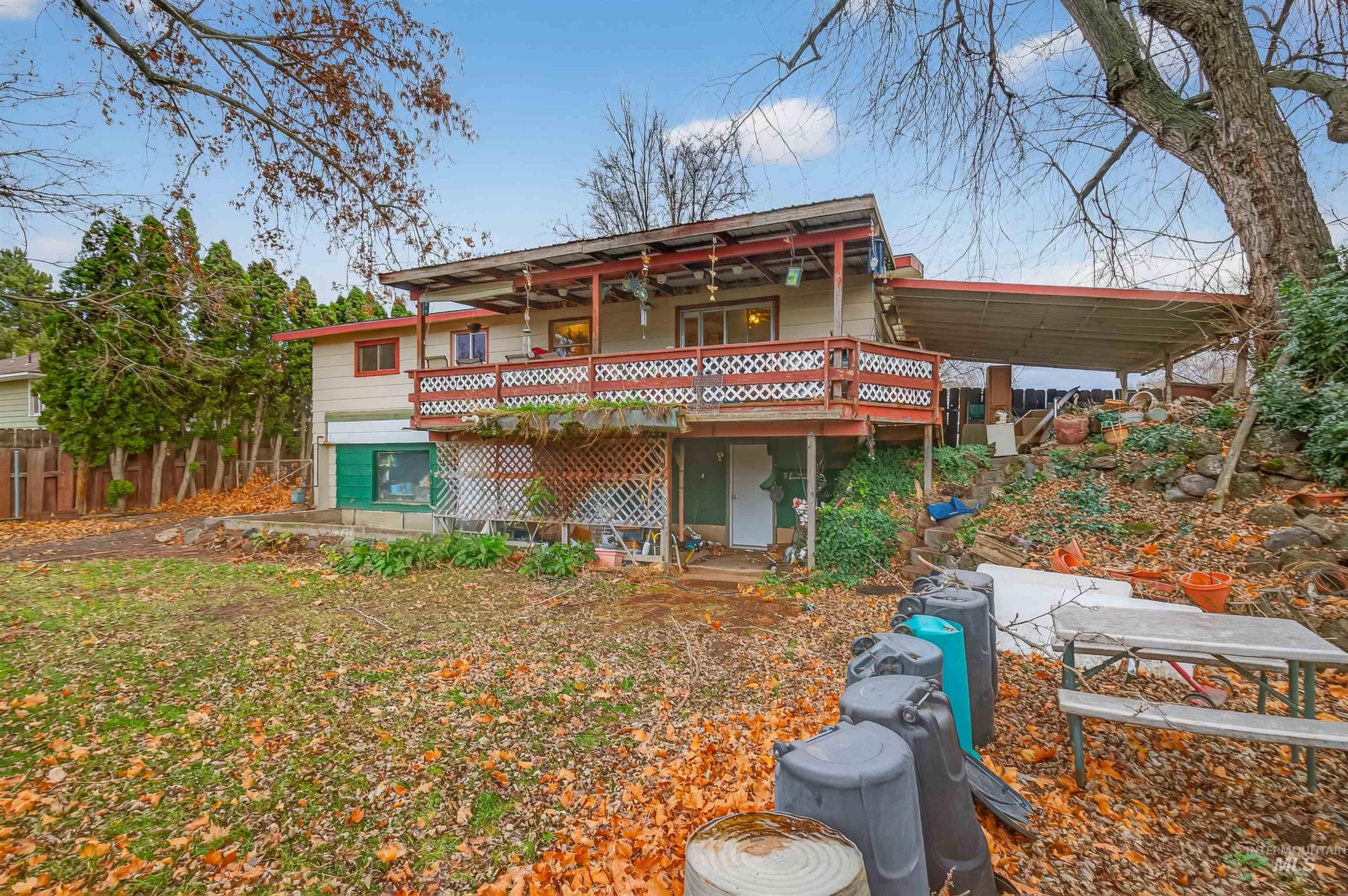 Back of property featuring a wooden deck