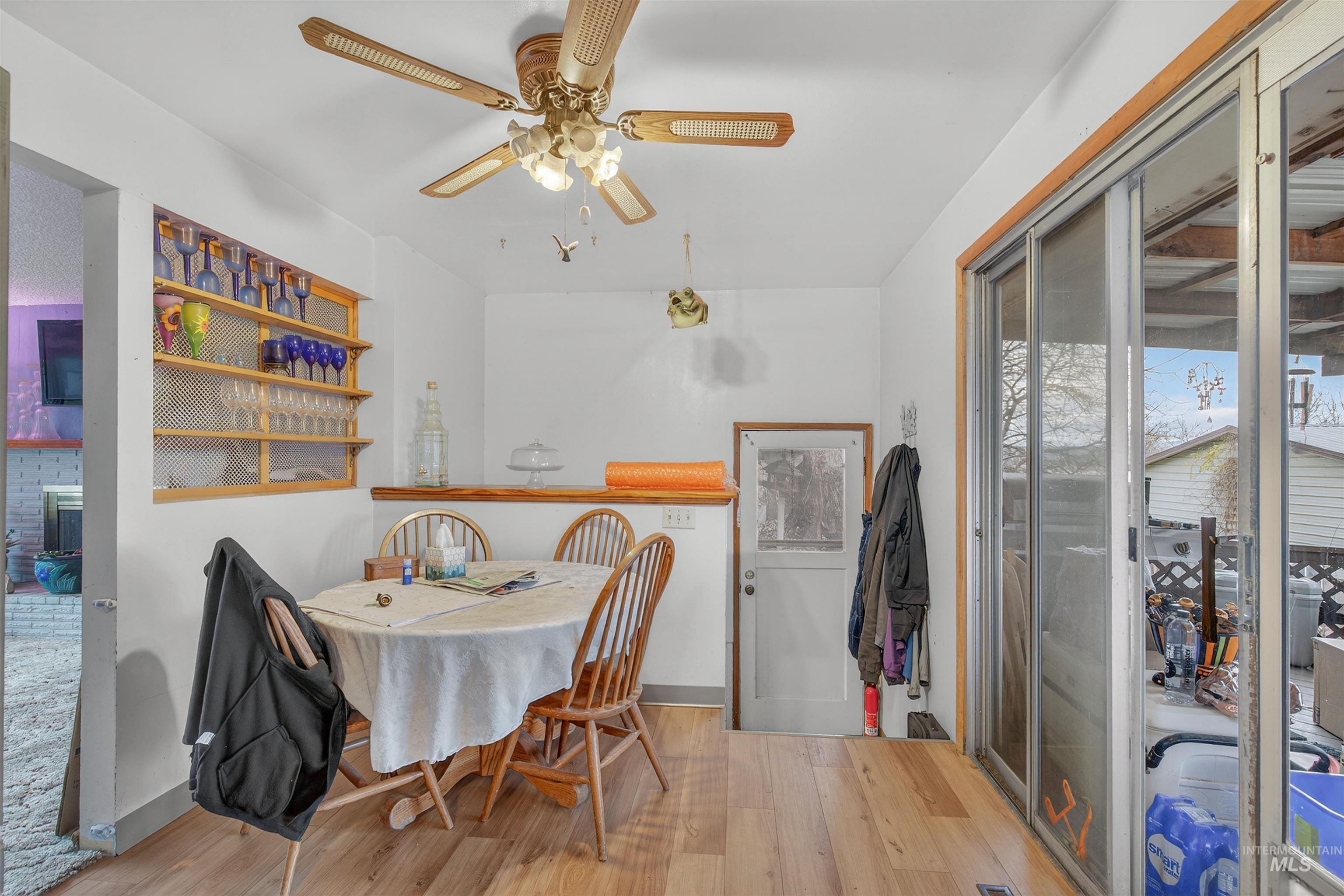 Dining room featuring light wood-style floors and ceiling fan