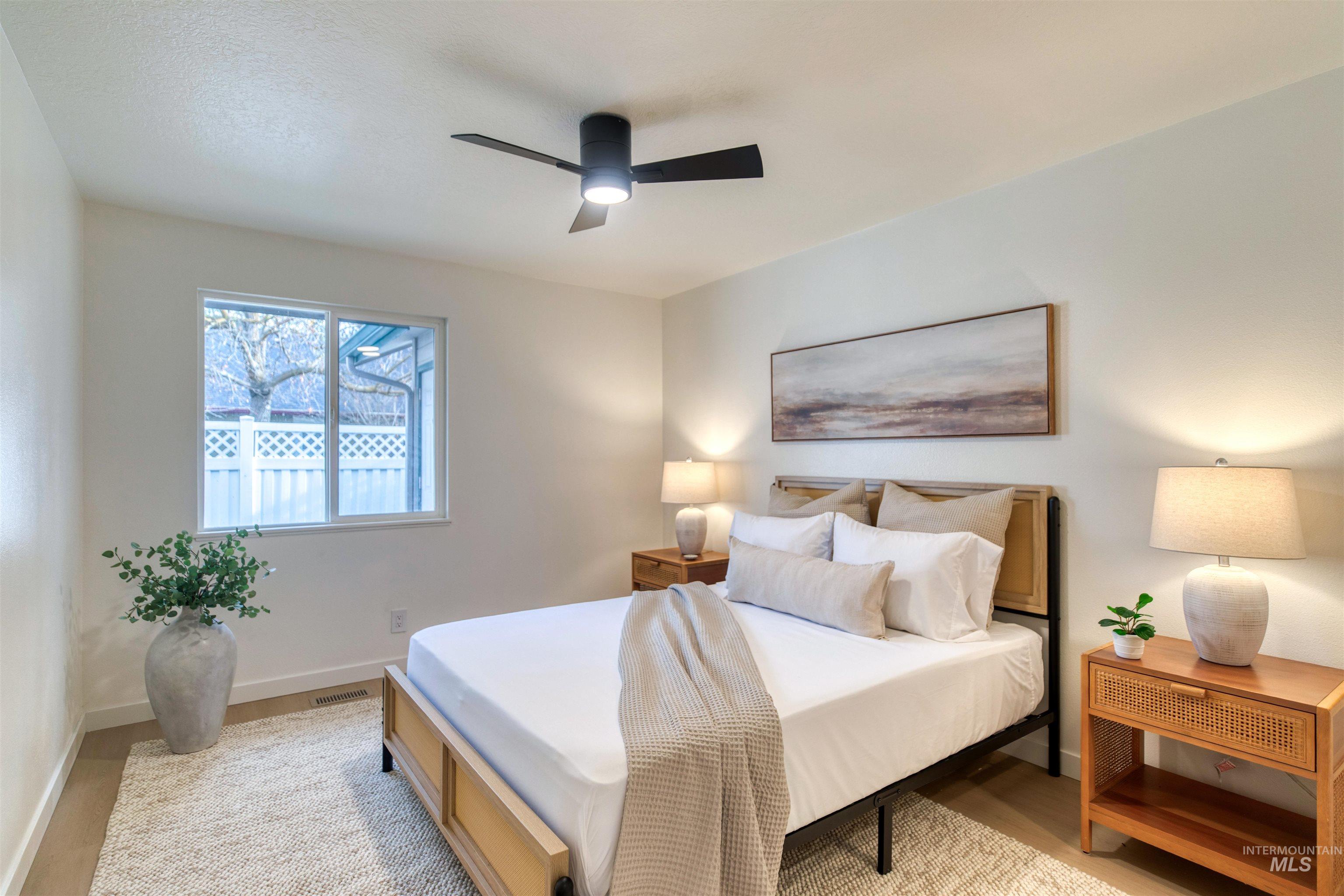 Bedroom featuring ceiling fan and wood finished floors
