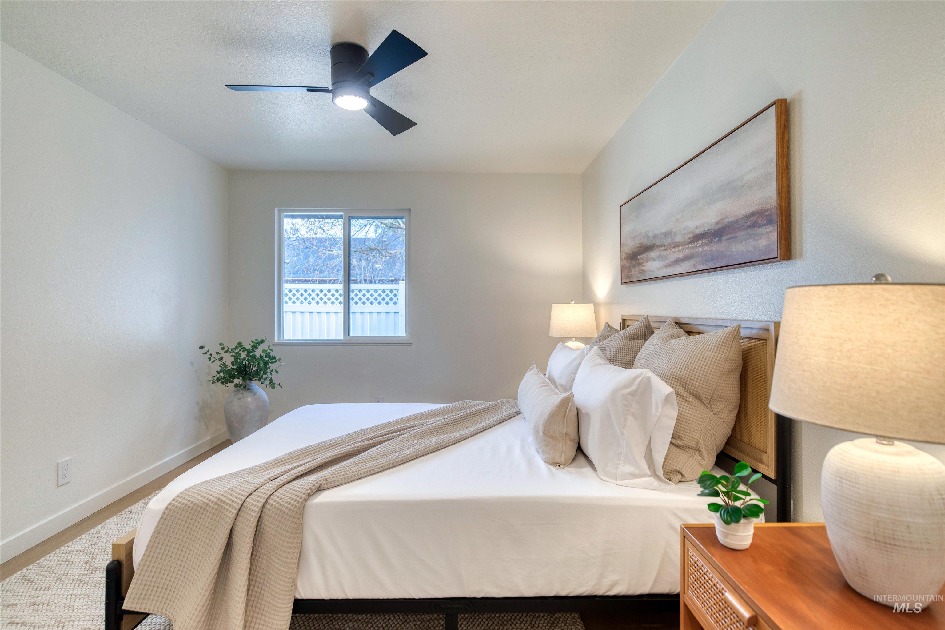 Bedroom with baseboards and ceiling fan