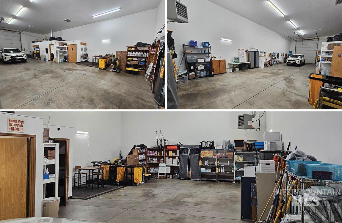 Garage featuring a heating unit and a workshop area