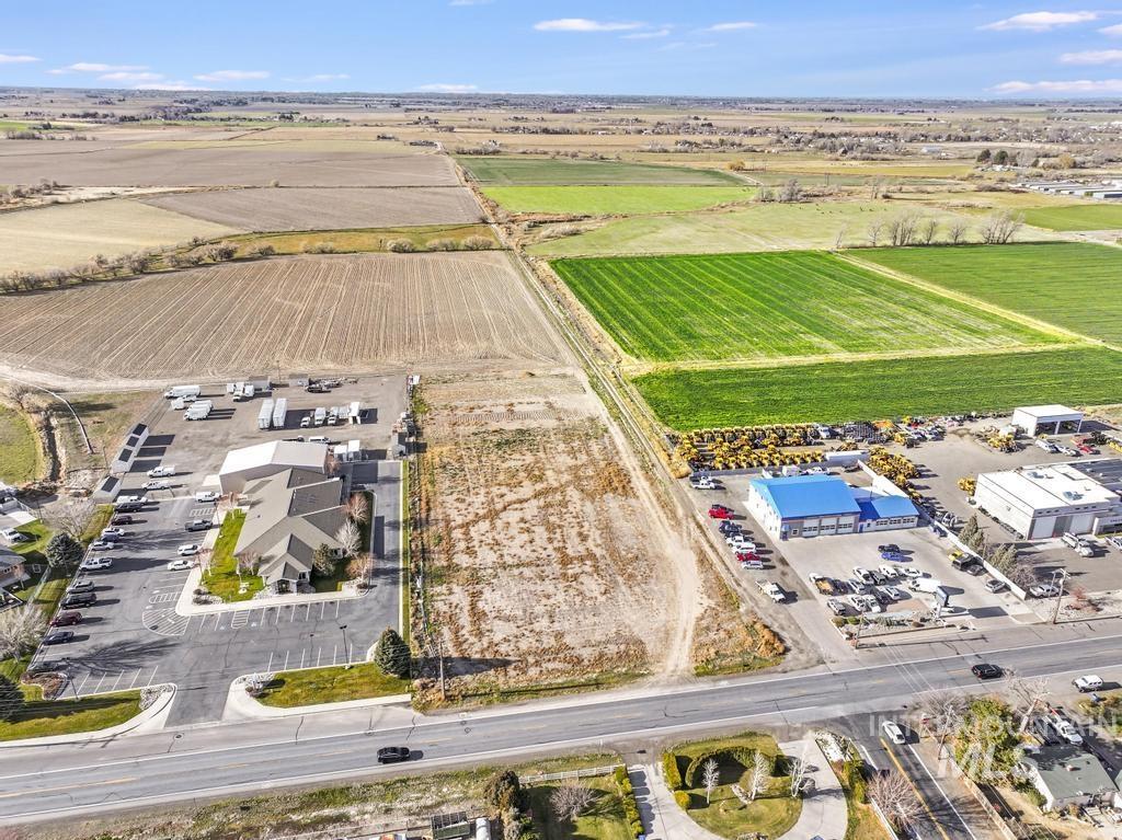 Aerial view of sparsely populated area with large plots for crops
