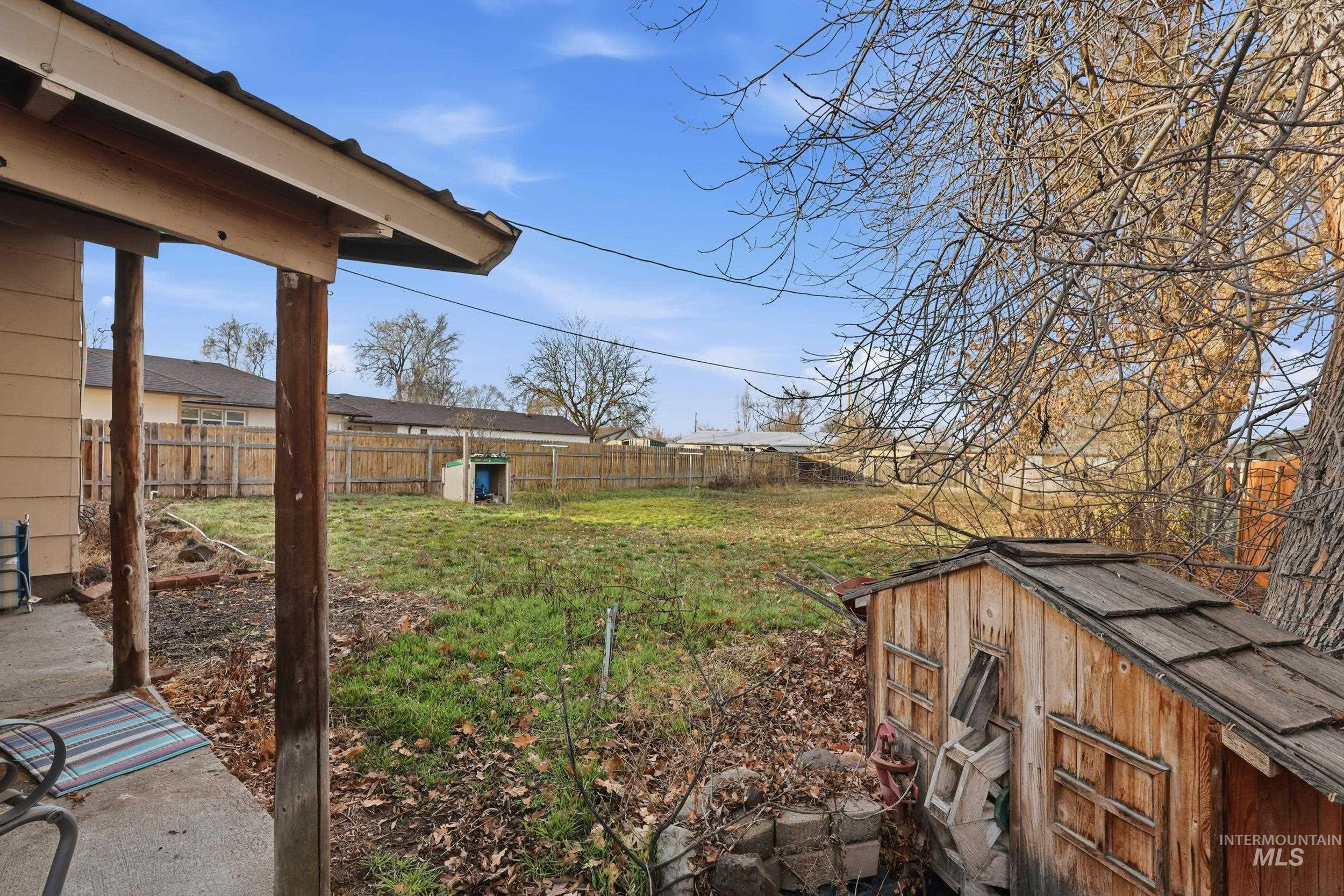 View of fenced backyard
