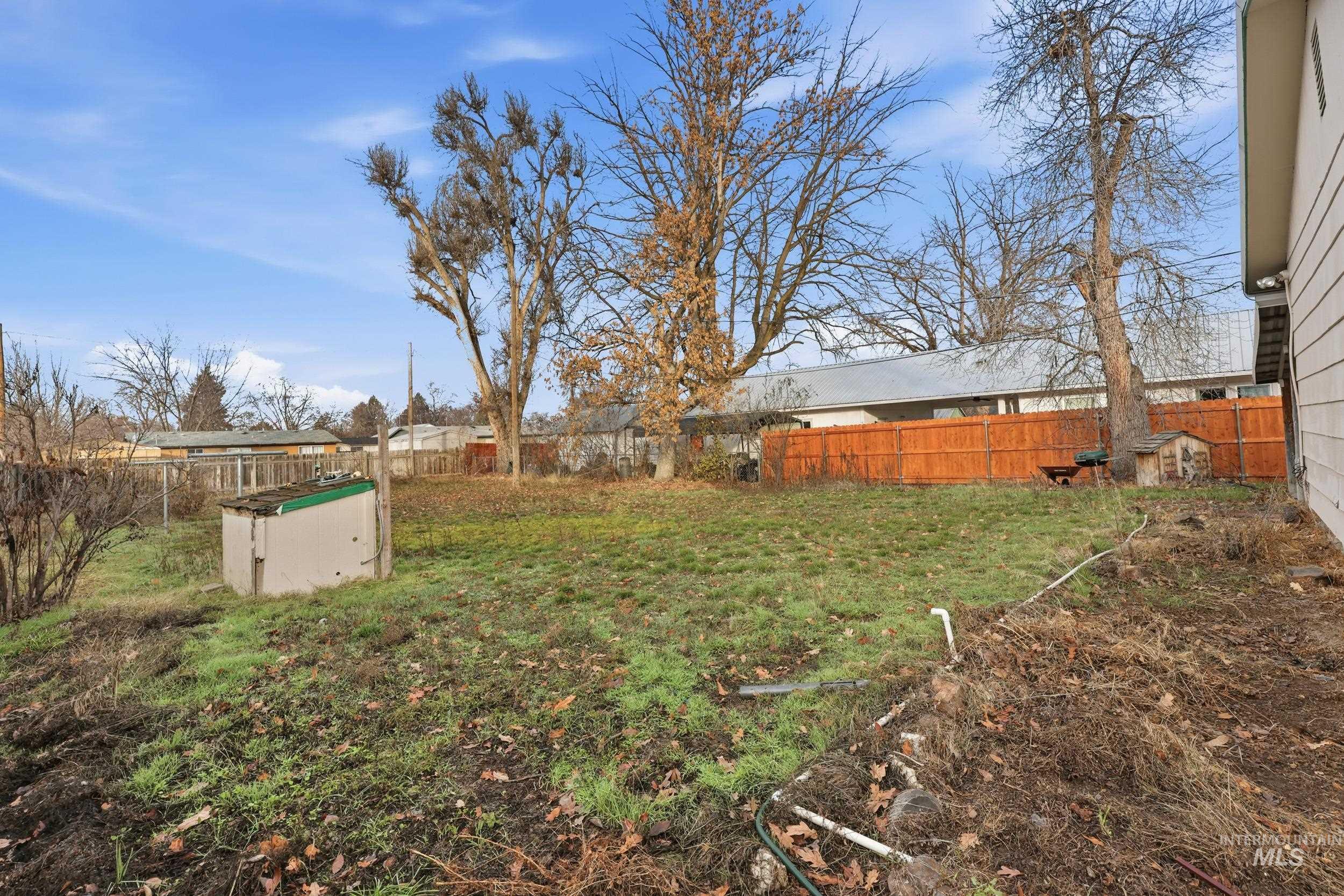 View of fenced backyard