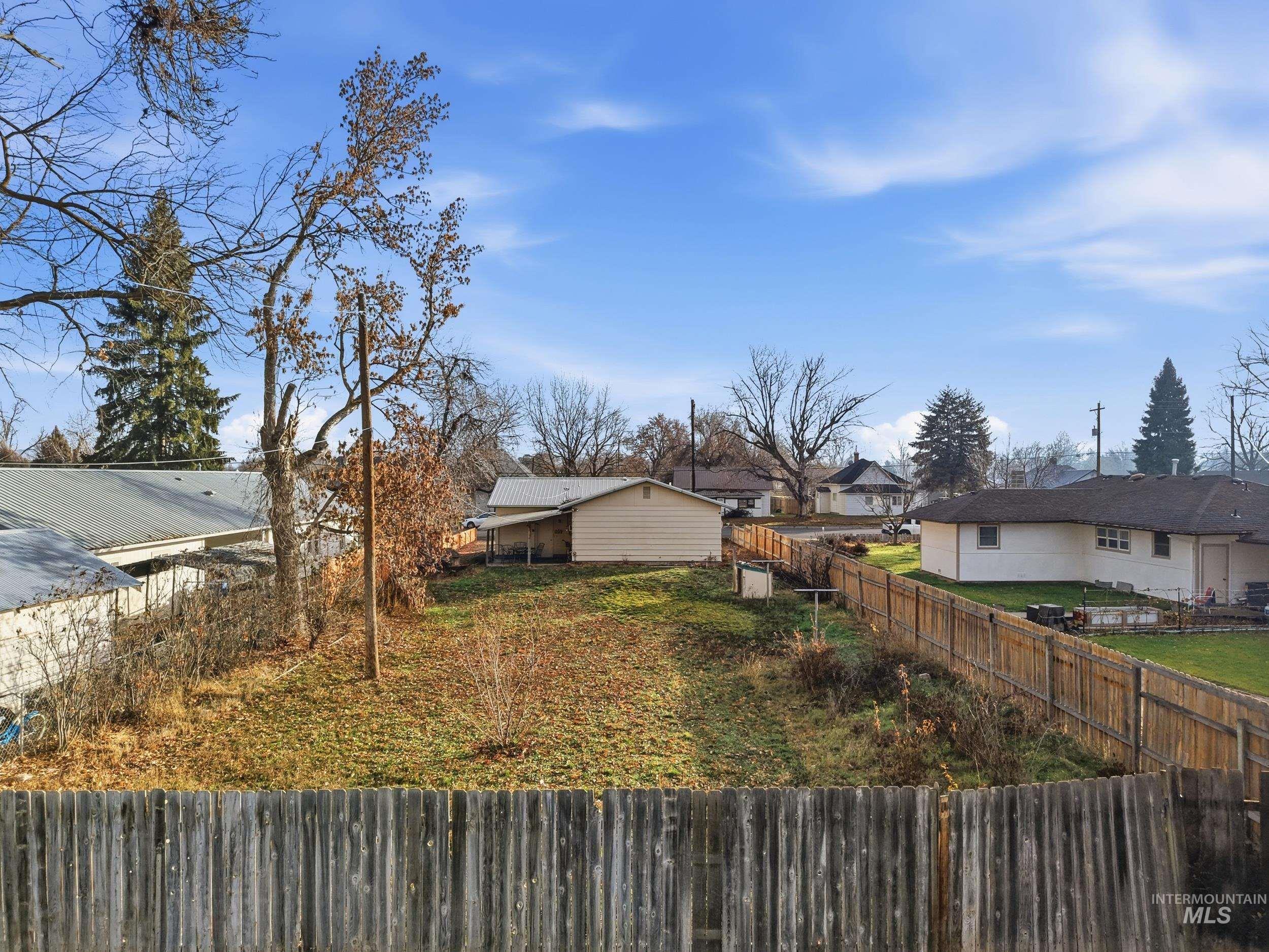 View of fenced backyard