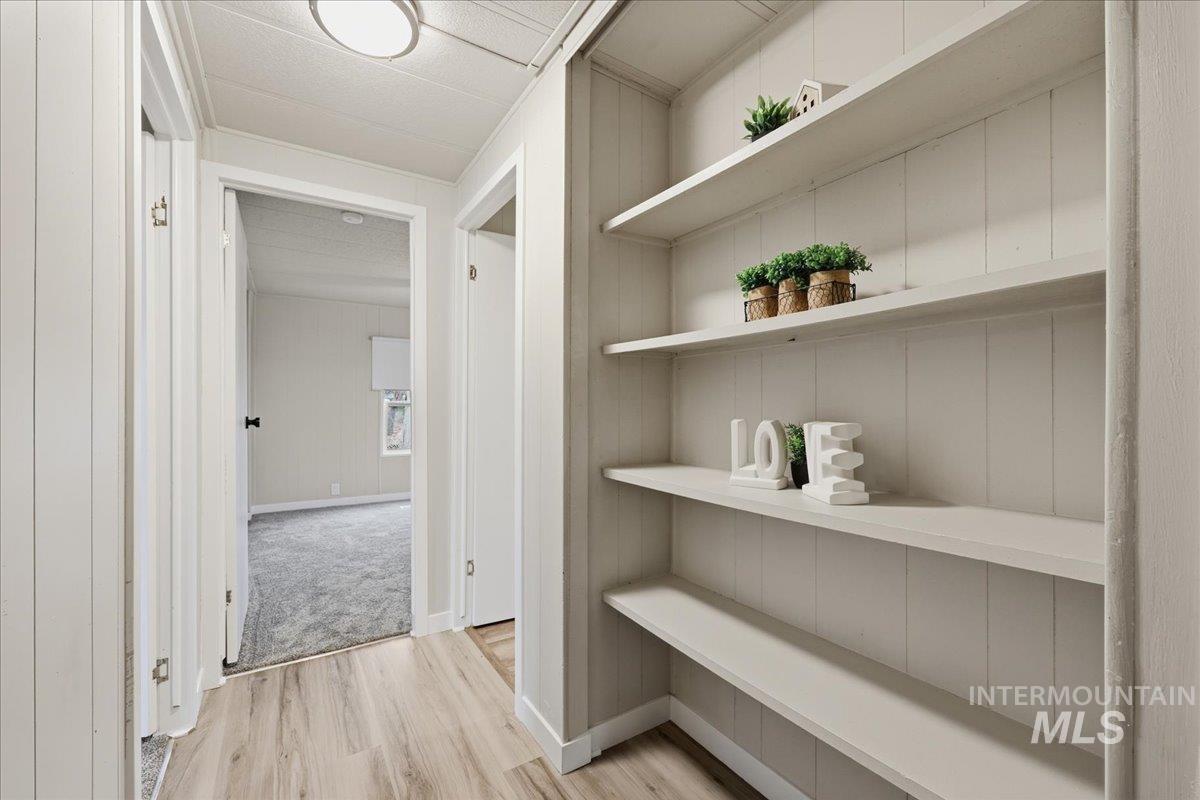 Hall featuring light wood-type flooring
