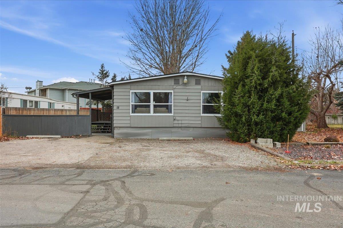 View of front of property with a patio area and a deck