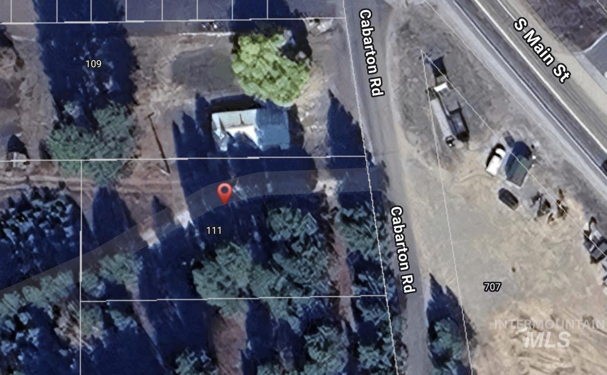 Aerial map of property and surrounding area featuring property parcel outlined