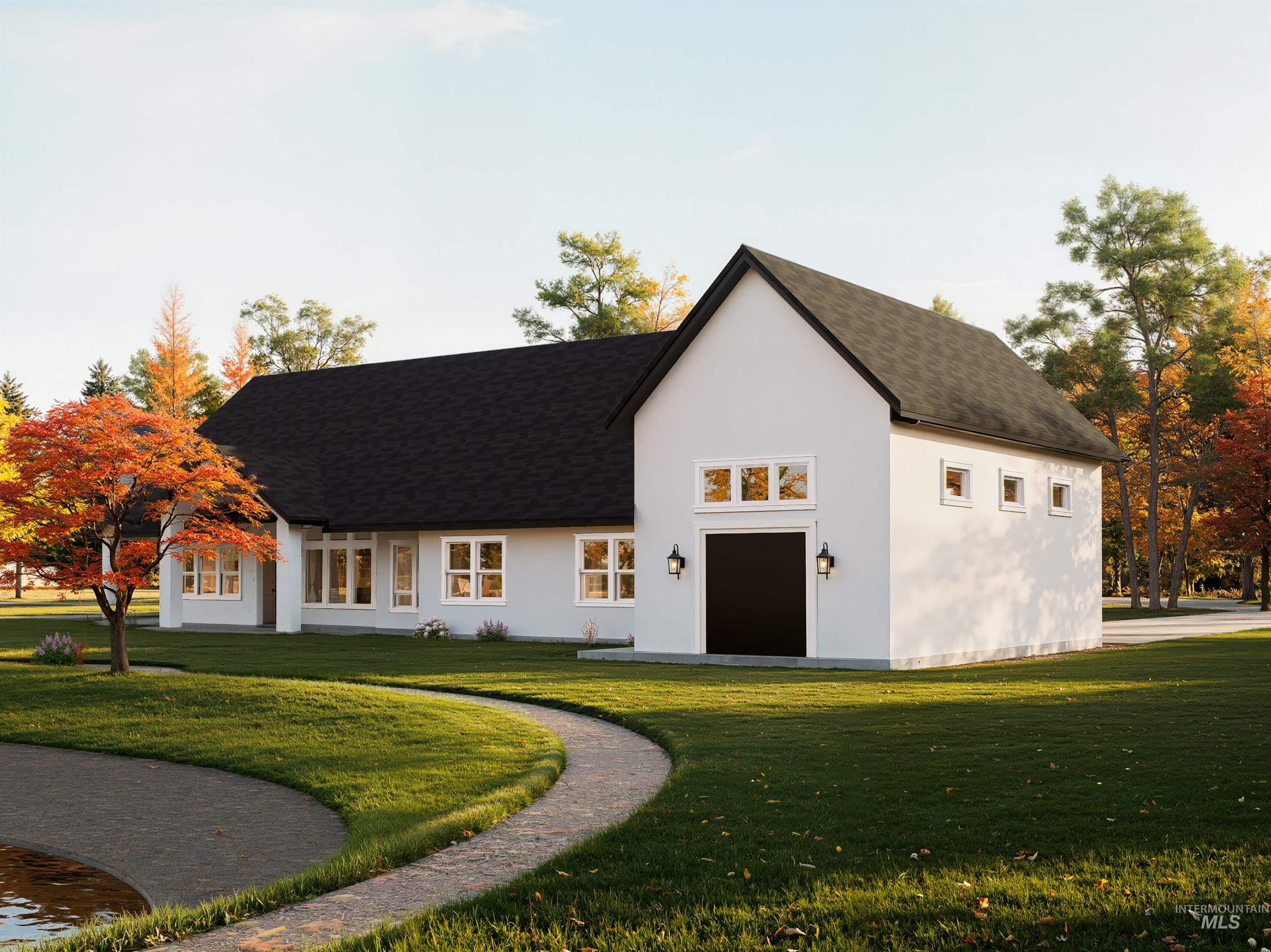 View of front of property with a front yard, a shingled roof, and stucco siding