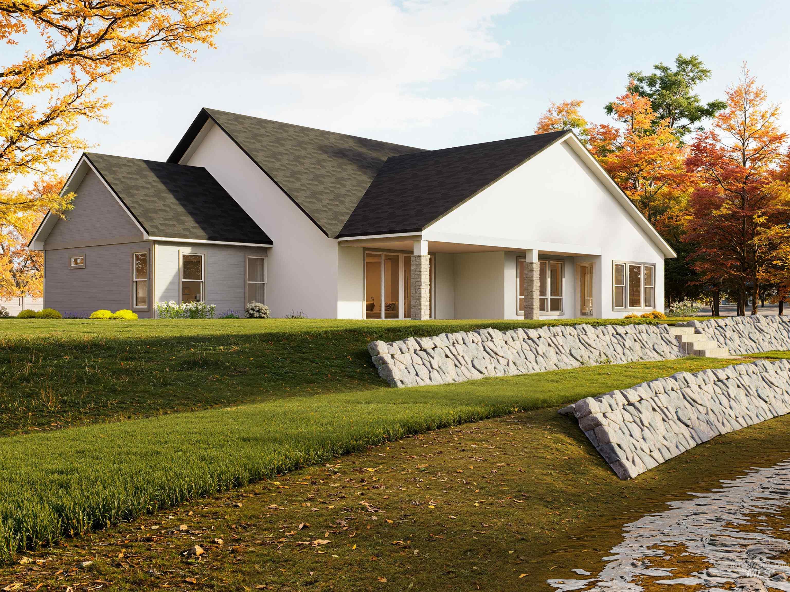View of front of property featuring stucco siding, a front lawn, and roof with shingles