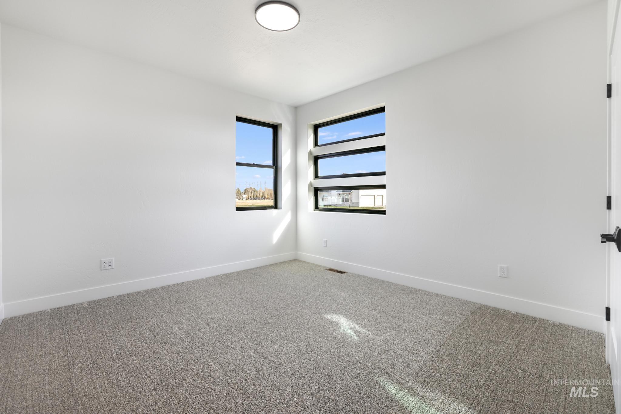 Unfurnished room featuring carpet flooring