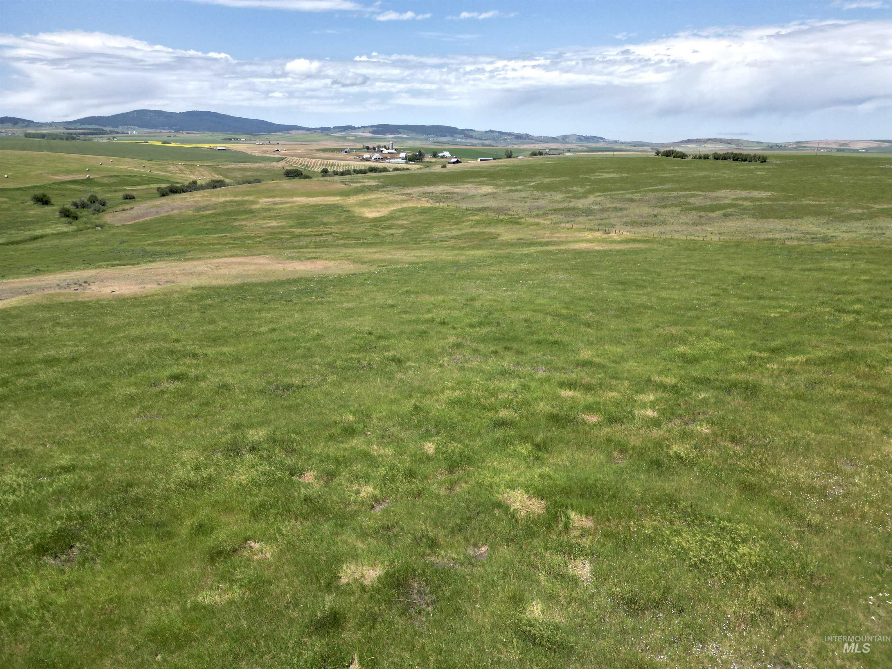 View of mountain backdrop featuring rural landscape