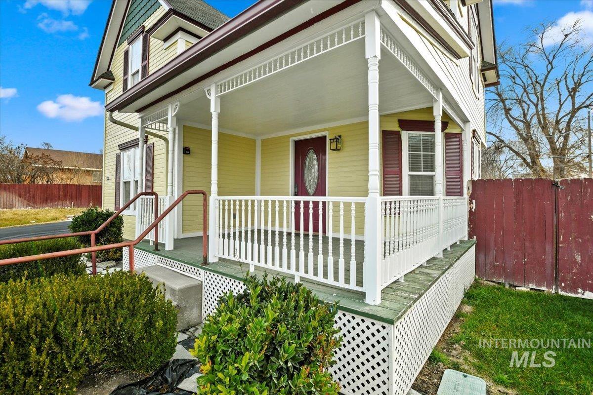 Entrance to property featuring a porch