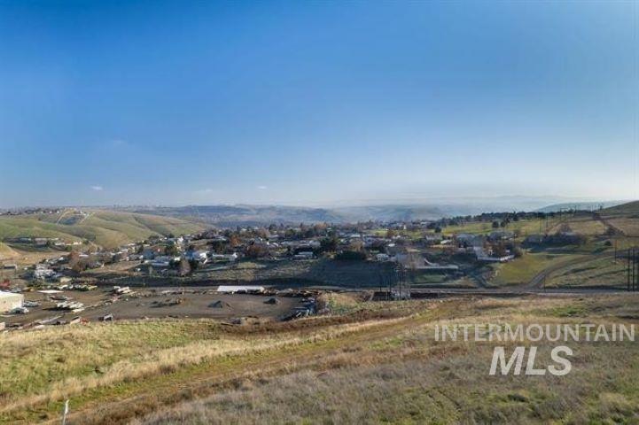View of mountain background featuring rural landscape