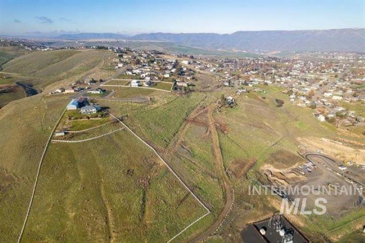 View of property location featuring a mountain backdrop and rural landscape