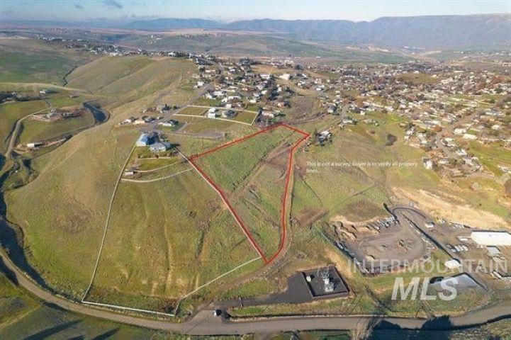 Aerial overview of property's location with a mountain backdrop