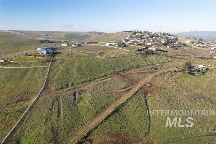 Aerial view of property and surrounding area with rural landscape