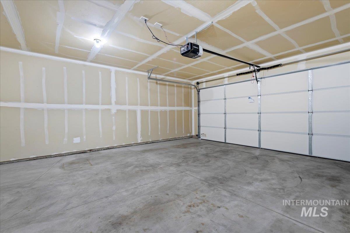 Garage featuring a garage door opener