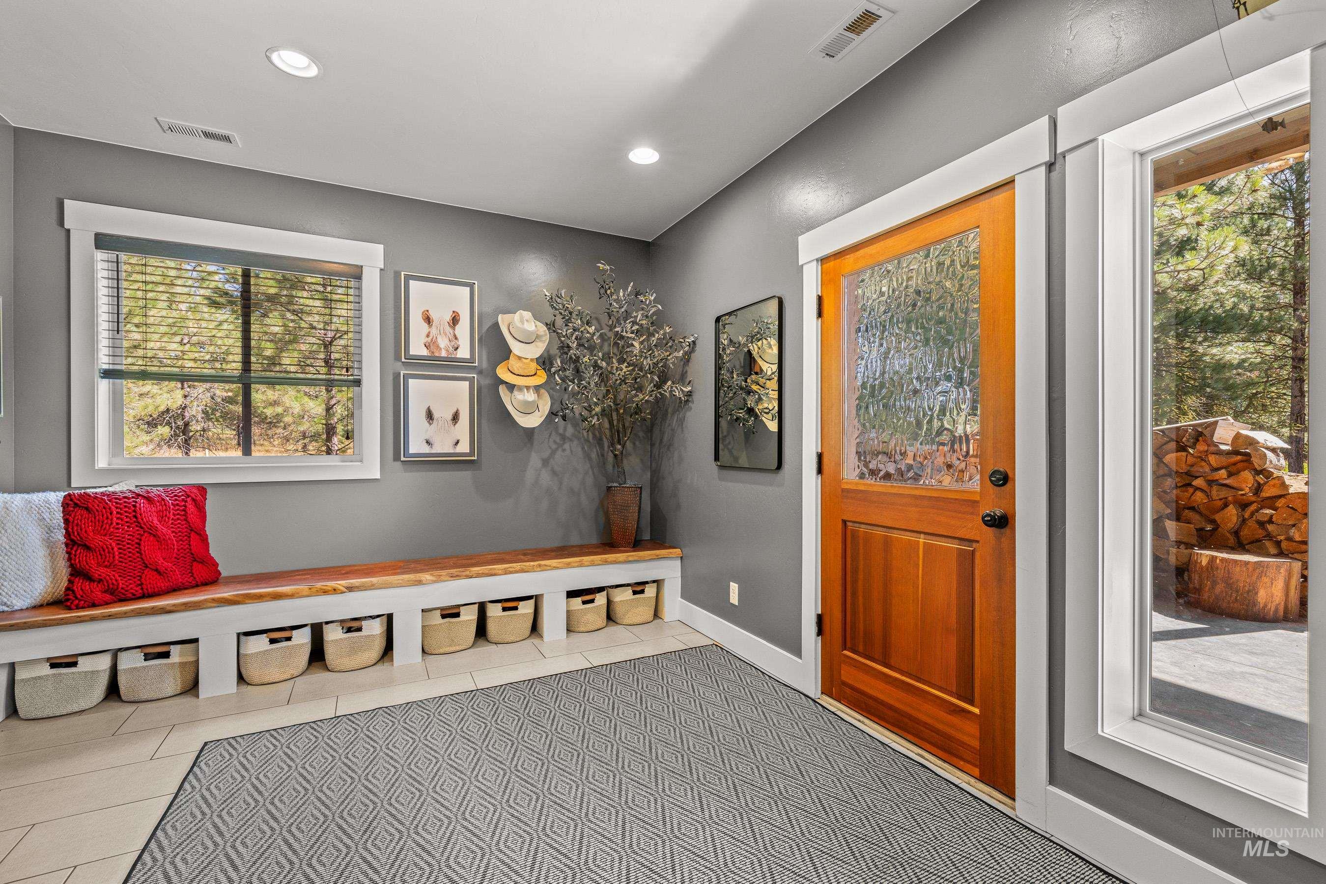 Mudroom featuring healthy amount of natural light