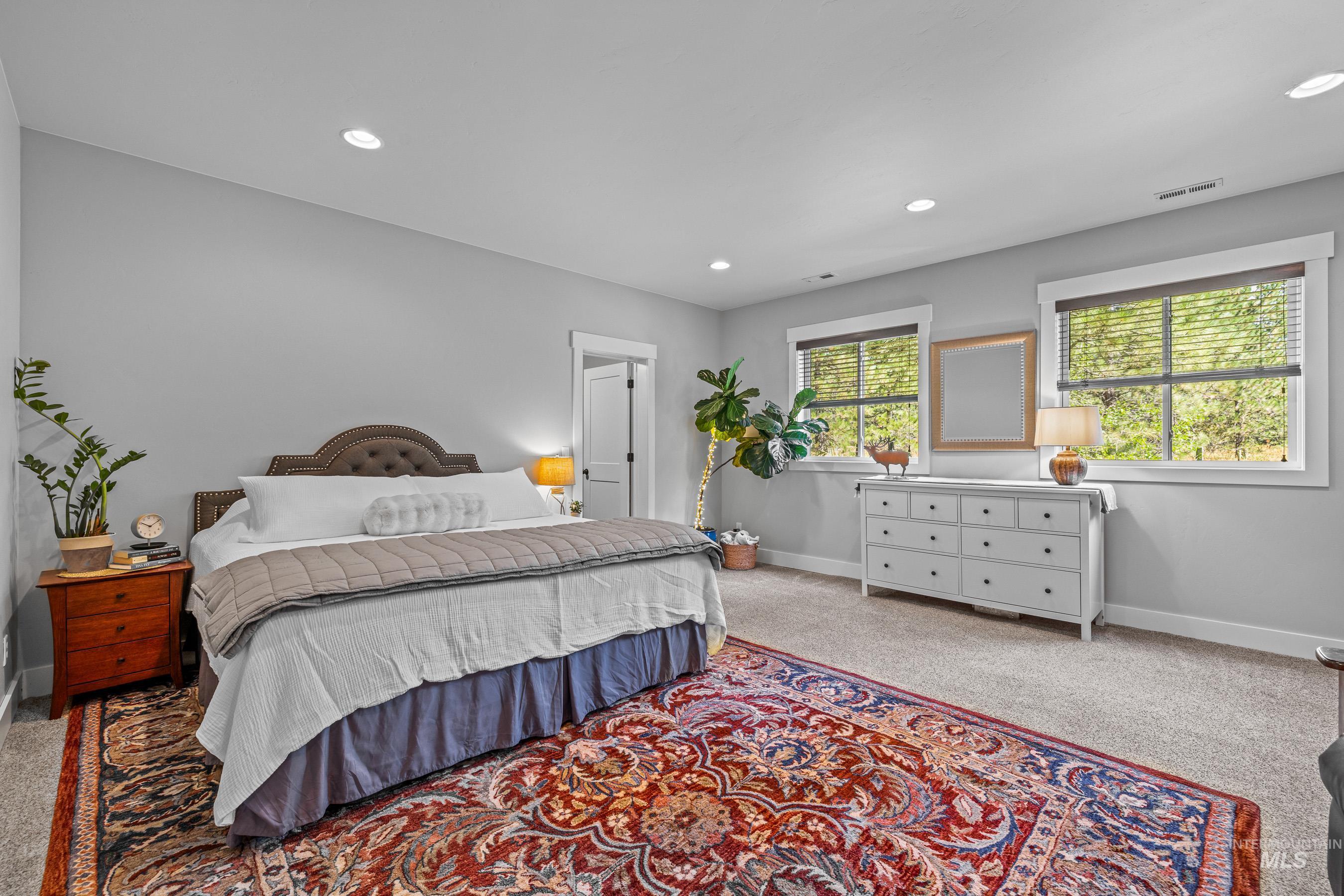 Carpeted bedroom featuring baseboards and recessed lighting