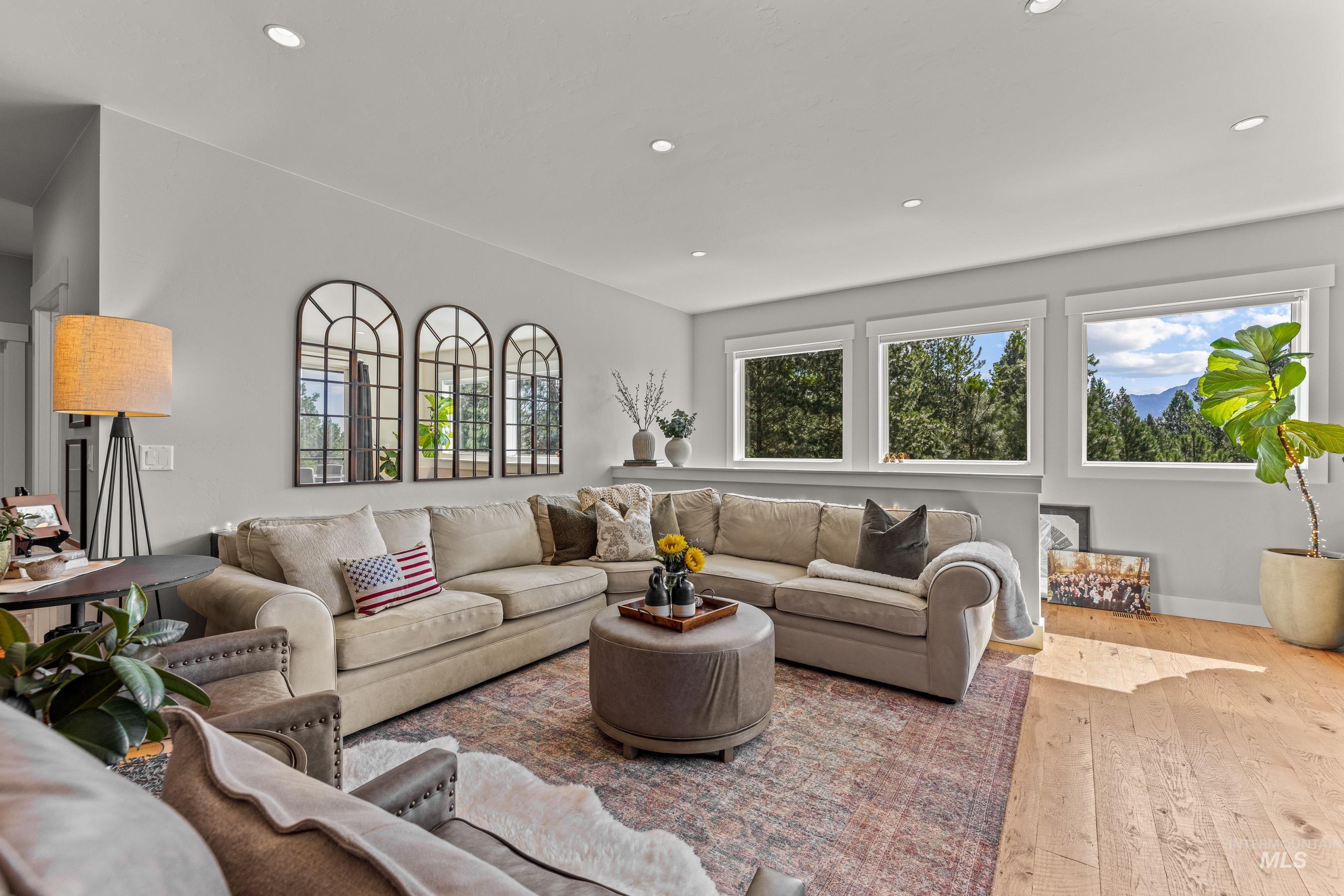 Living room featuring hardwood / wood-style flooring and recessed lighting