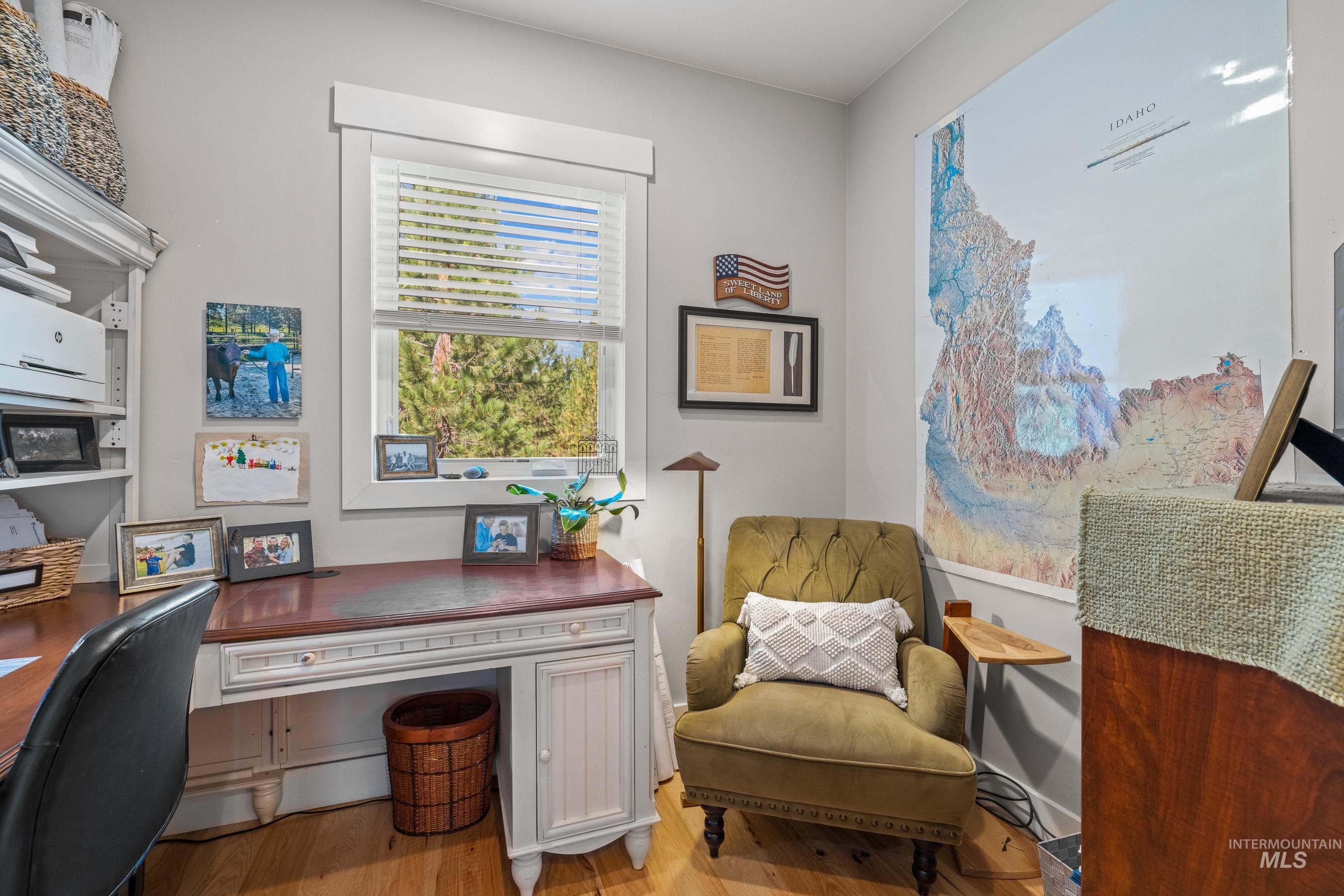 Office space featuring light wood-style floors