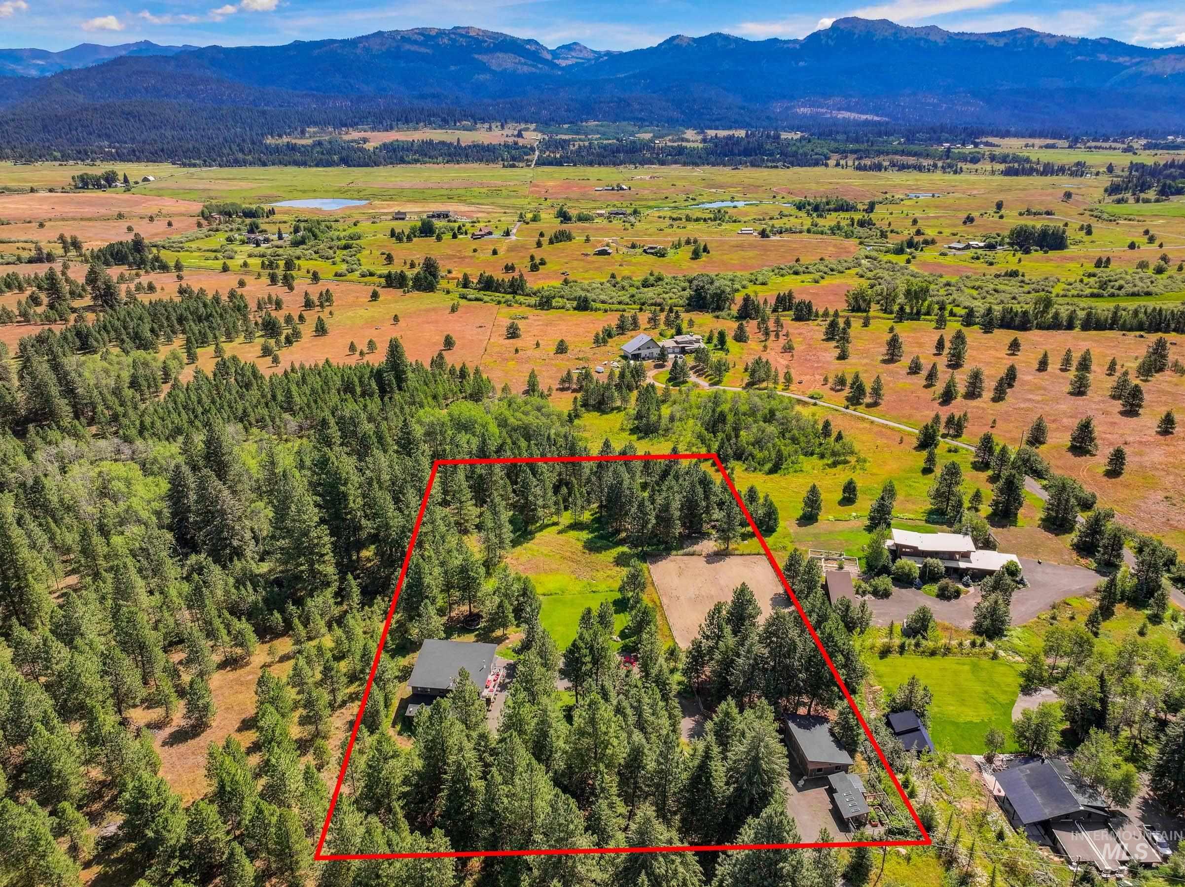 View of property location with a mountainous background and property parcel outlined