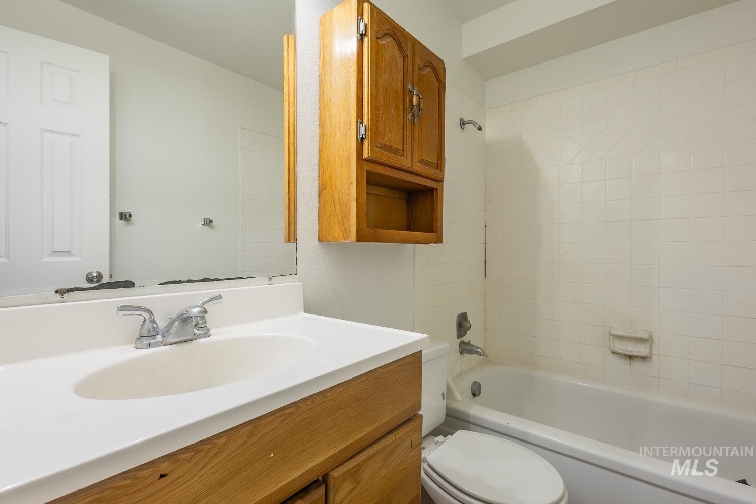 Full bathroom with vanity and  shower combination