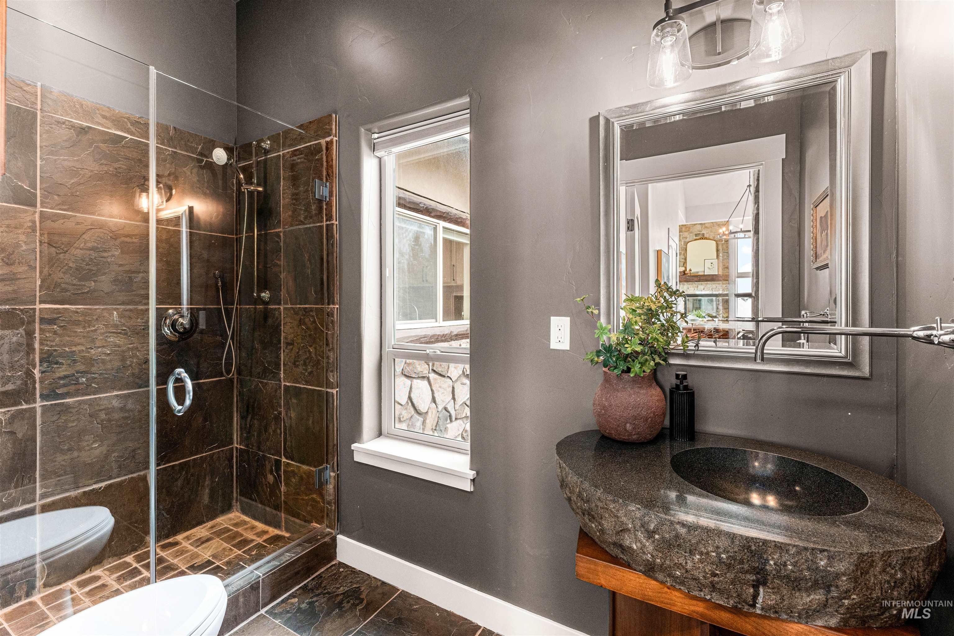 Full bathroom with a shower stall and vanity