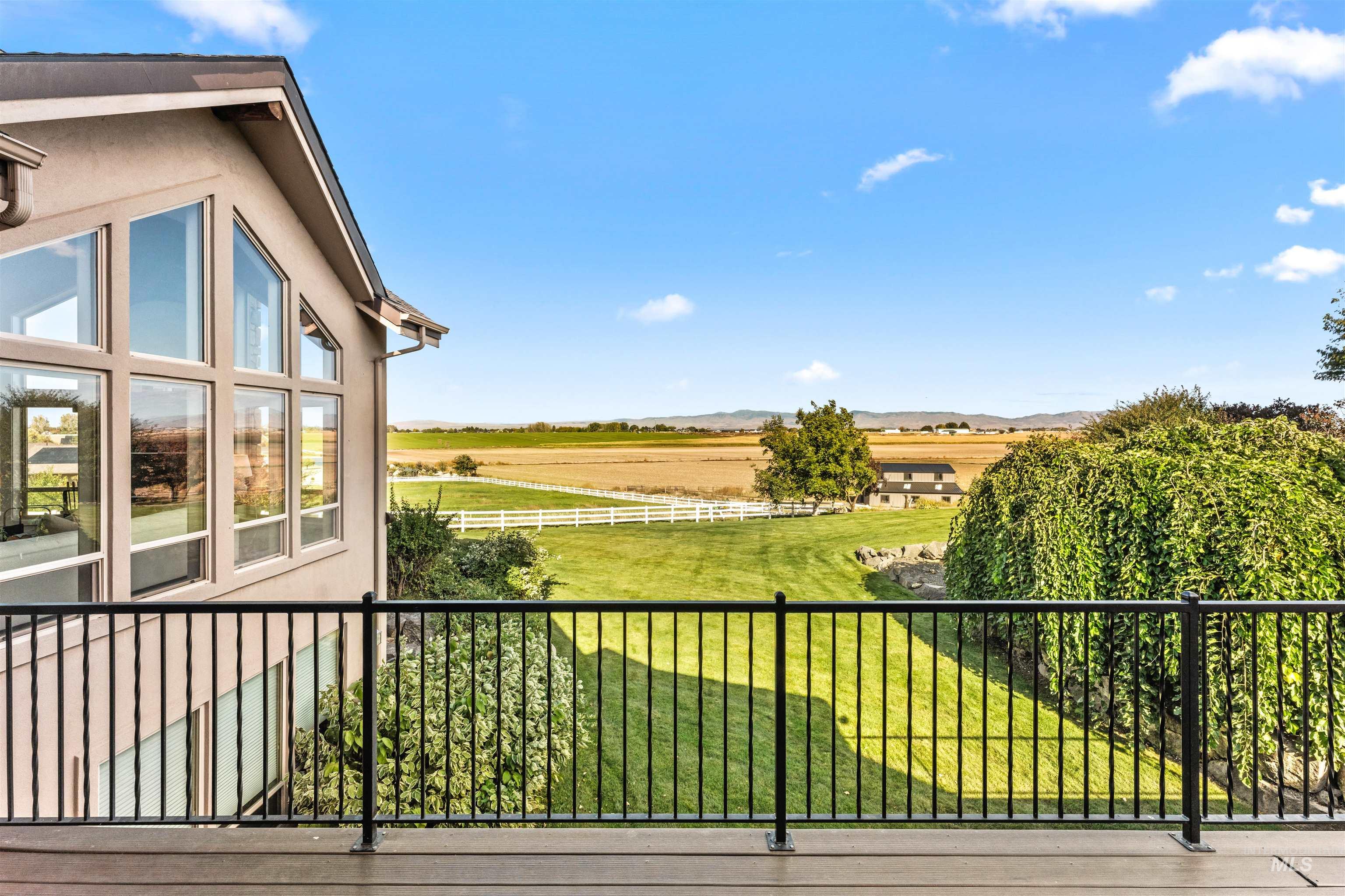 Balcony featuring a view of rural / pastoral area and a mountain view