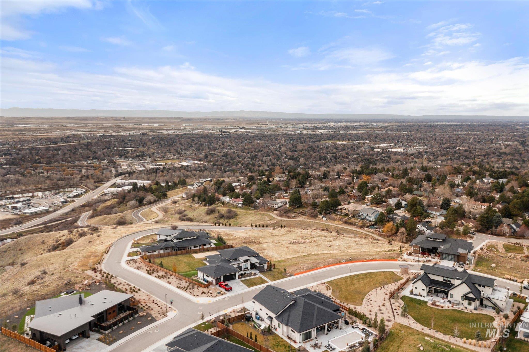Aerial overview of property's location with nearby suburban area