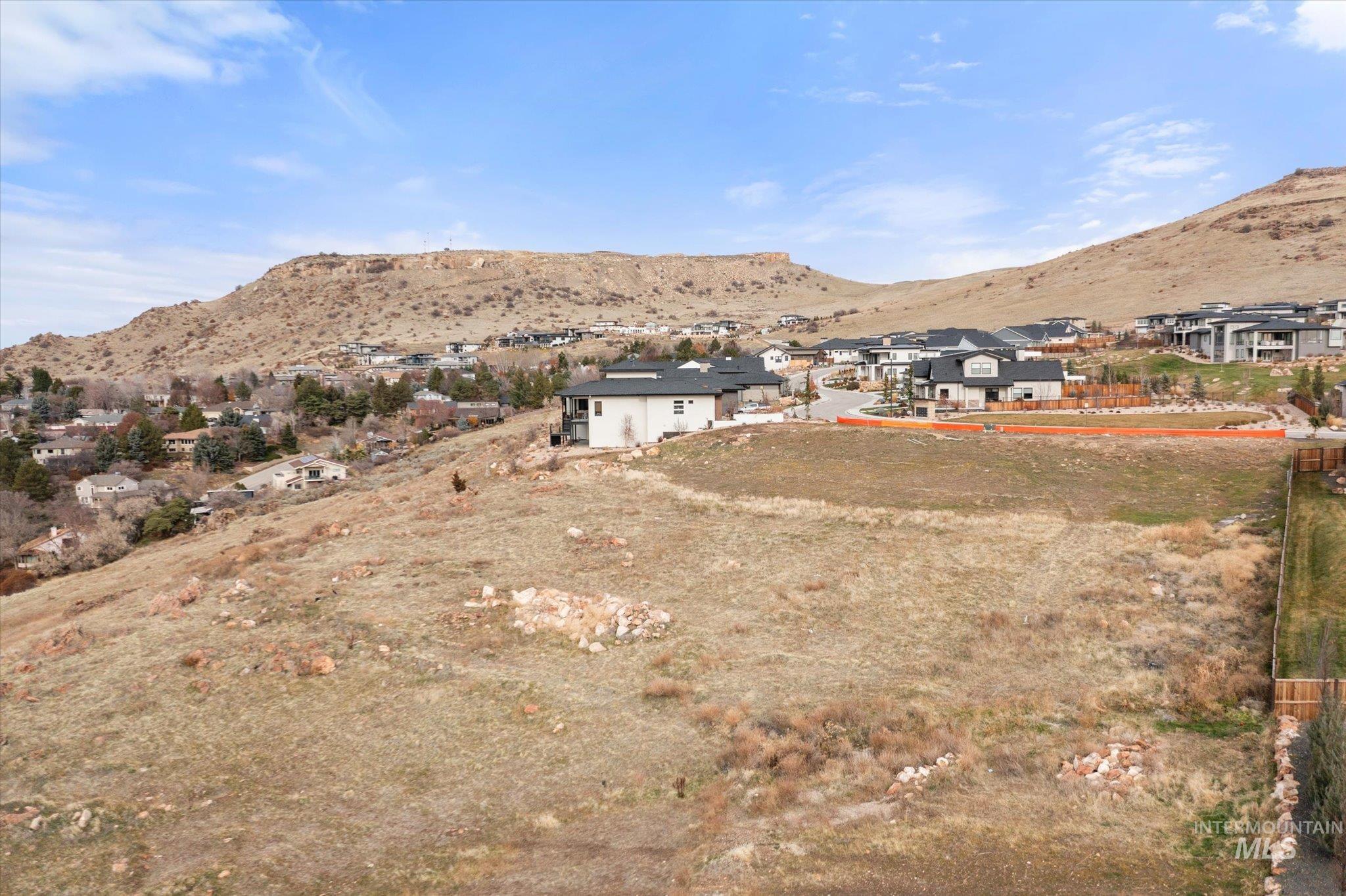 View of mountain backdrop with nearby suburban area